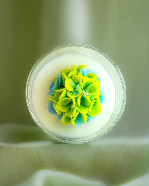 Grace soy wax candle with green and yellow floral design in clear glass jar by Lila with Love