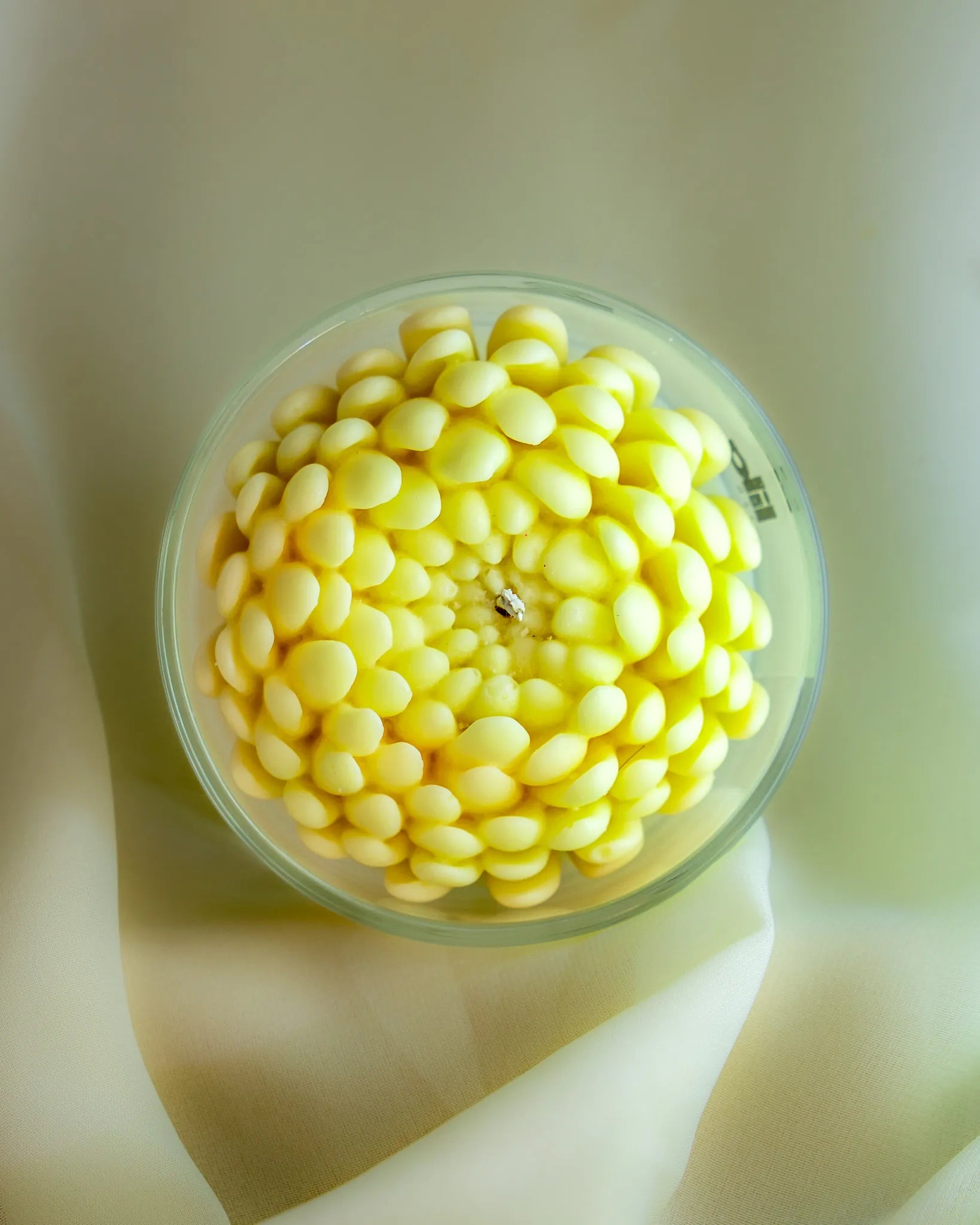 Insane soy wax candle with layered yellow petal design in clear glass jar by Lila with Love