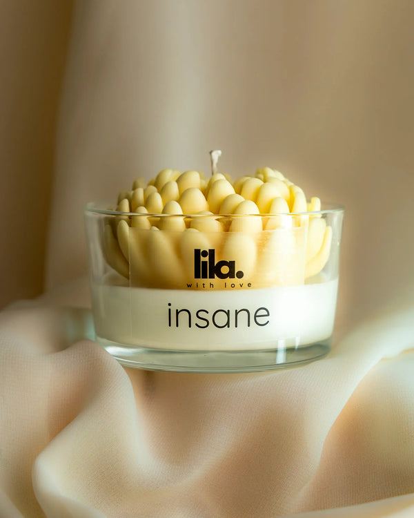 Insane soy wax candle with layered yellow petal design in clear glass jar by Lila with Love