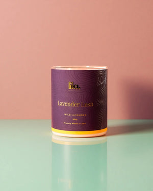lavender lush from lila candle on a reflective surface with a pink background