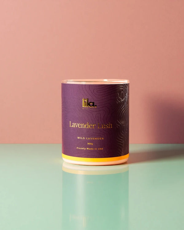 lavender lush from lila candle on a reflective surface with a pink background