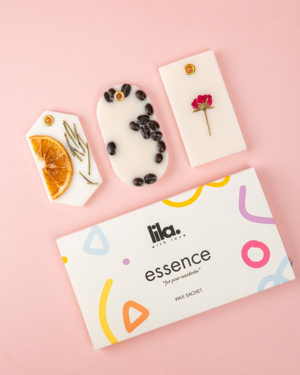 Lila essence wax sachets  packaging with floral and fruit designs on a pink background